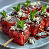 Juicy watermelon feta bites, bursting with mint and creamy cheese, perfect party appetizers.