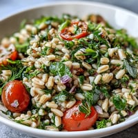 Fresh Barley and Herb Salad with bright lemon, perfect for a light summer meal.